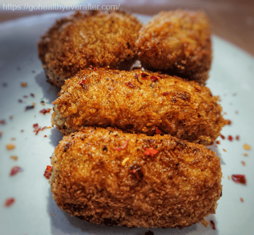 close-up view of Italian potato croquettes with cheese.